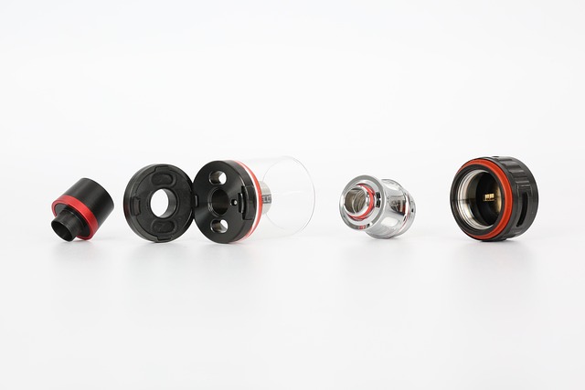 This image shows the disassembled components of a vape atomizer, including the mouthpiece, black main body, transparent e-liquid reservoir, coil, and base. Arranged on a white background in a disassembled state, the parts clearly demonstrate the device’s replaceable and maintainable structure, embodying the sustainable feature of "reusable vape devices with replaceable accessories."